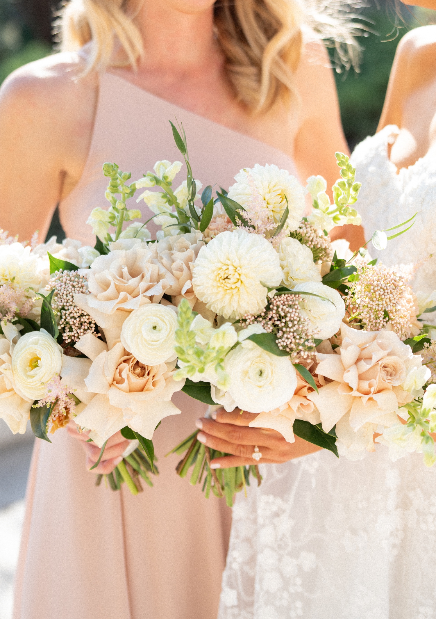 Bridesmaid holding bouquet at Revel motor row weddings, photography by Allison Francois