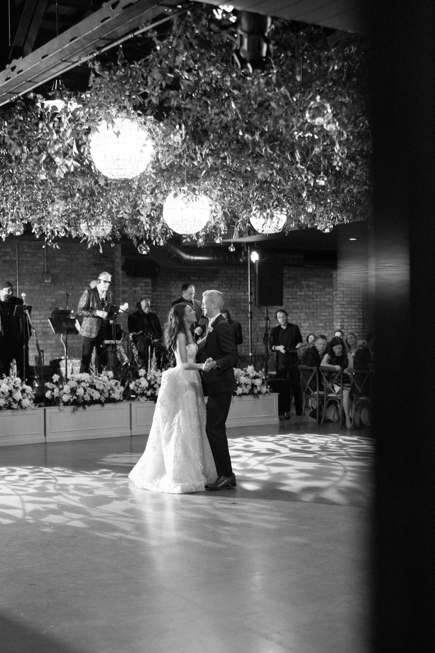 Bride and groom dancing at wedding at revel motor row chicago
 by Chicago Wedding Photographer Allison Francois