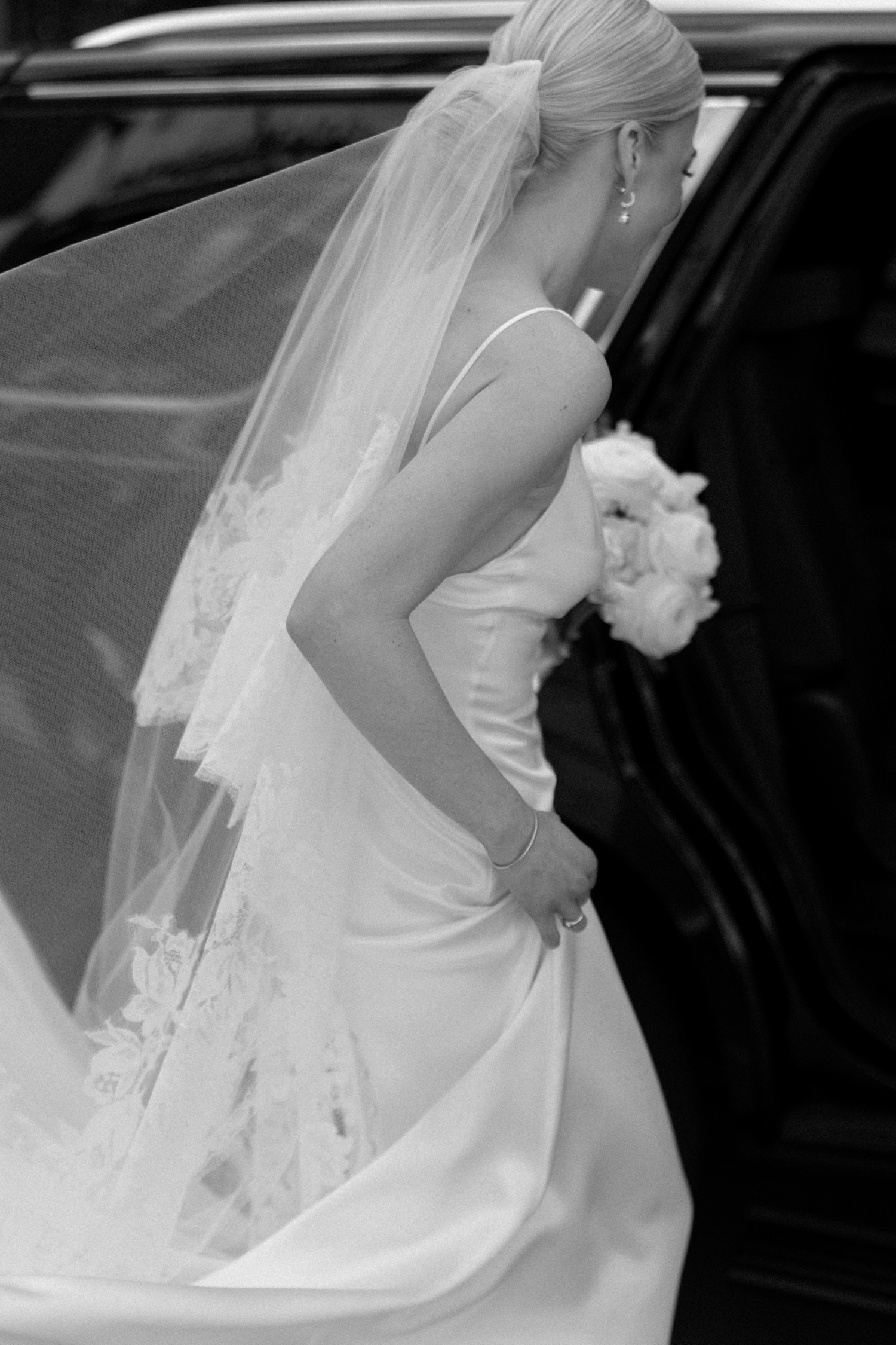 bride getting in car at intercontinental hotel wedding
