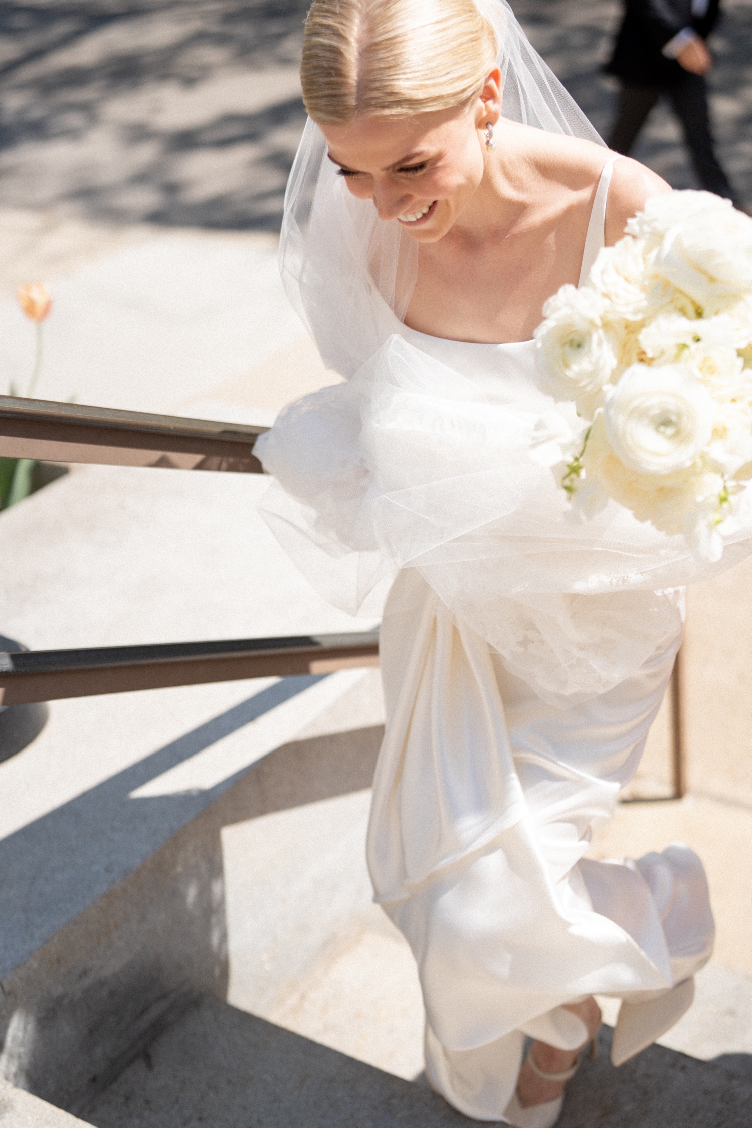 bride walking up stairs at intercontinental hotel wedding
