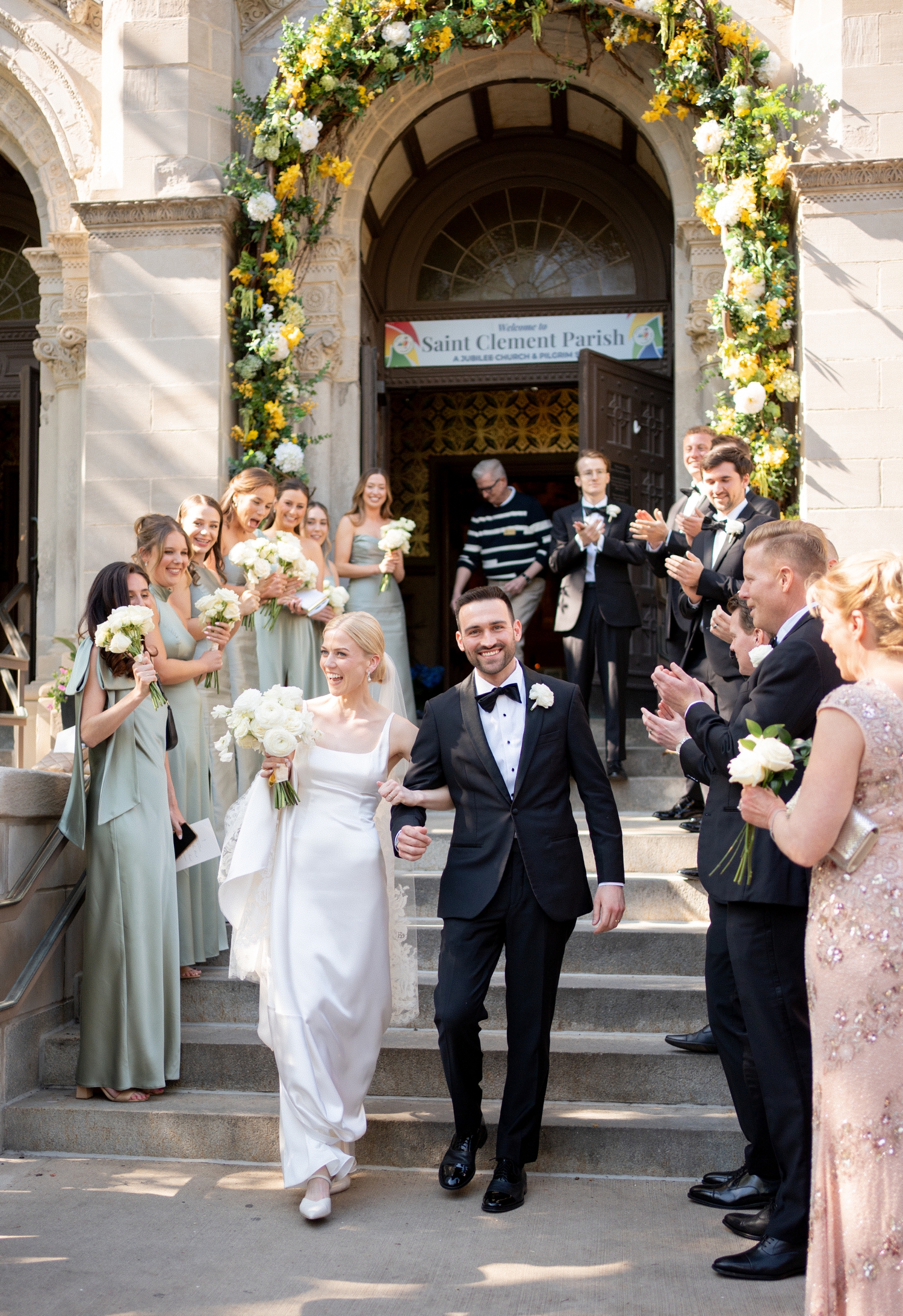 bride and groom walking out of church after wedding ceremony