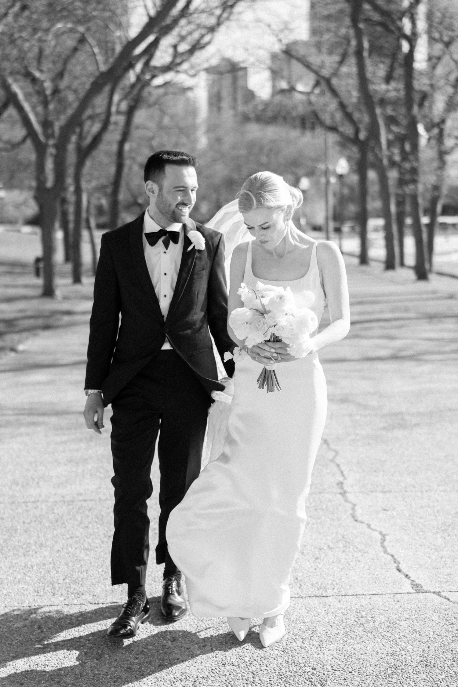 bride and groom walking at chicago continental hotel