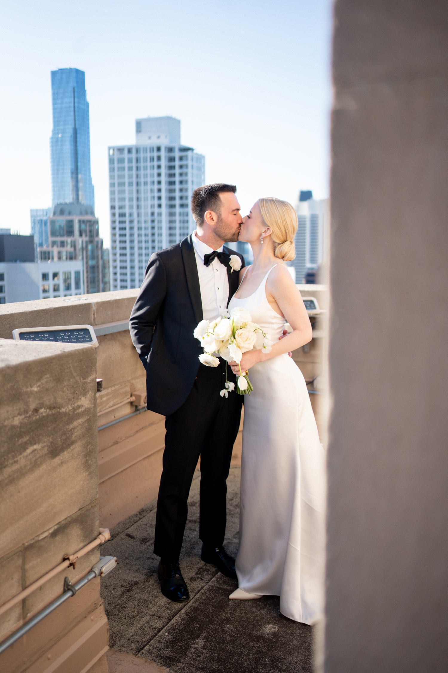 bride and groom kissing at continental hotel chicago
