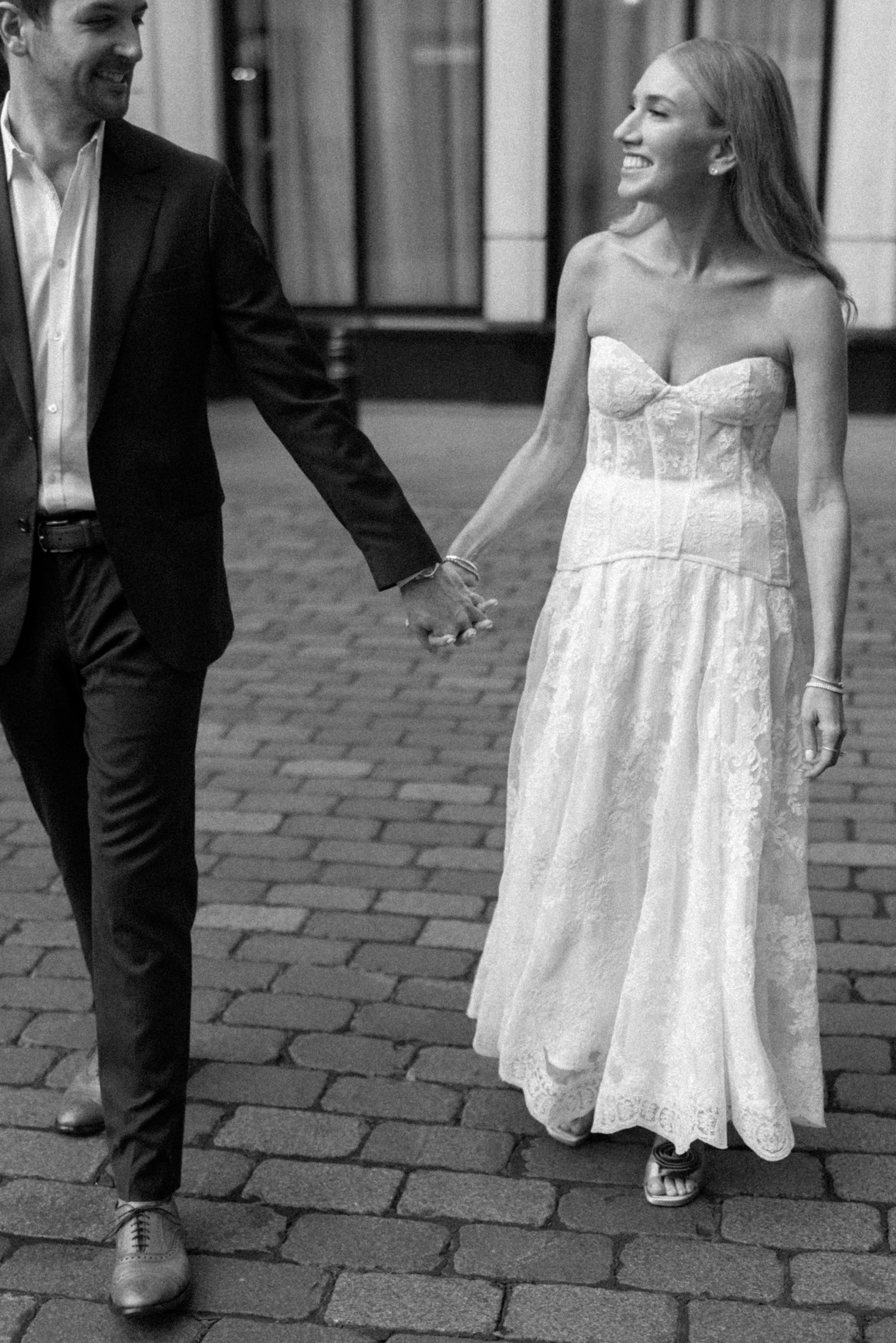 Couple holding hands at their Chicago History Museum Wedding by Chicago Wedding Photographer Allison Francois