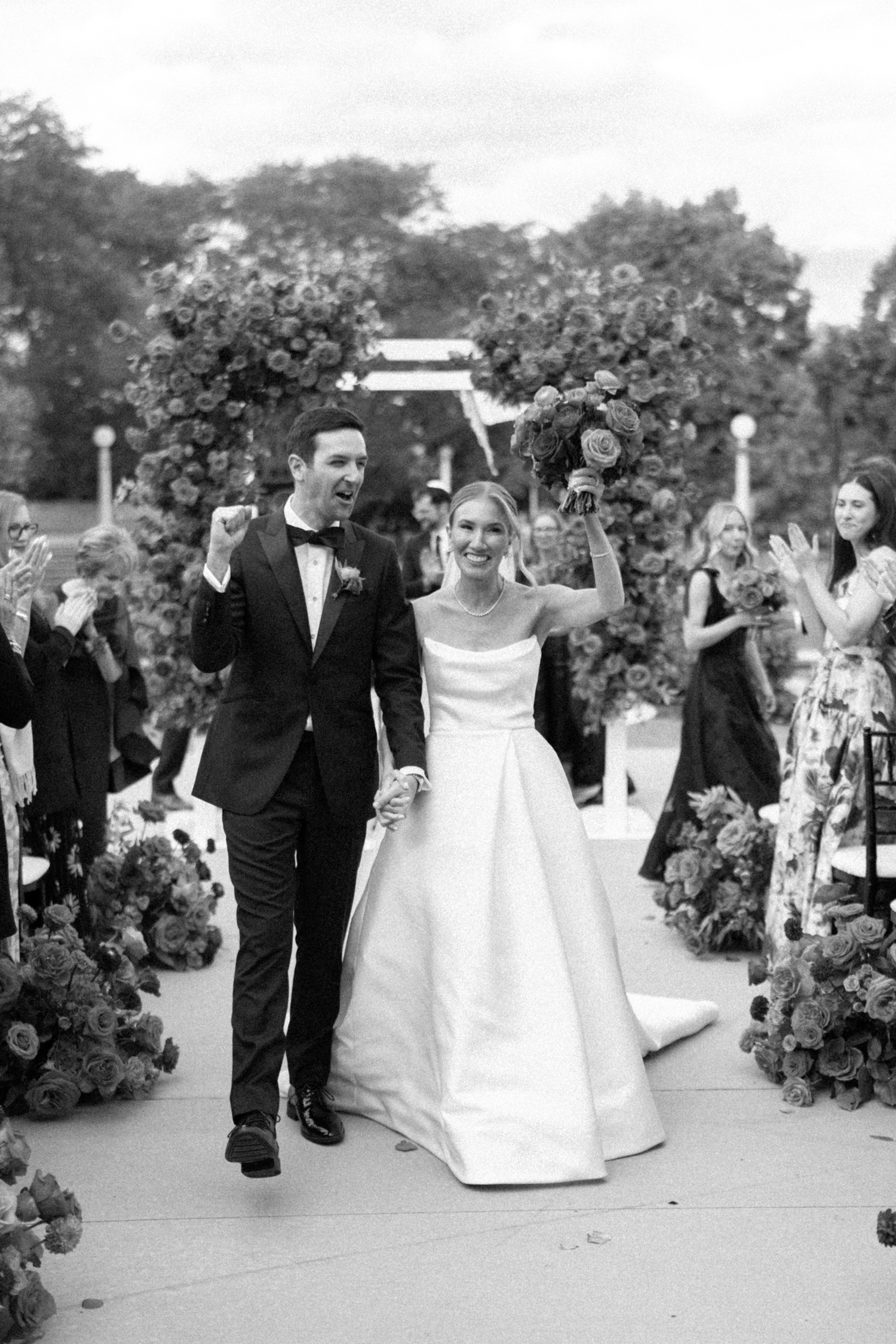 chicago history museum wedding photos​ of bride and groom cheering after ceremony, by Allison Francois